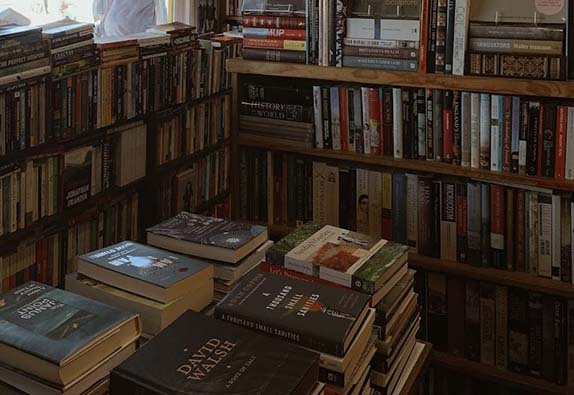 bent books interior books stacked and in the shelves